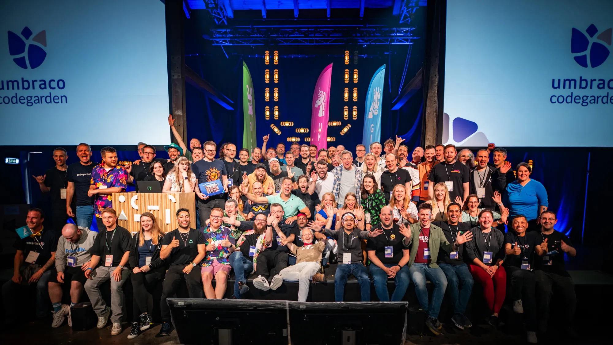 A group shot of all of the new and renewed MVPs who could attend Codegarden this year, smiling at the camera from the Codegarden stage