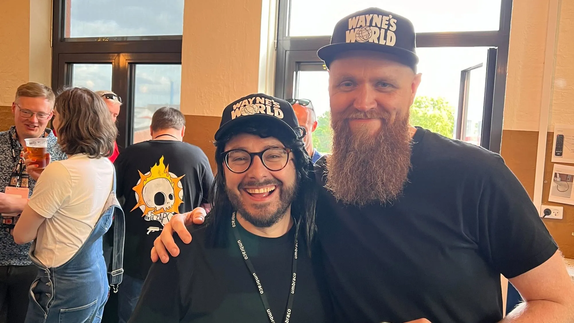 Rick and Matt at Umbraco HQ wearing matching black "Wayne's World" baseball caps and black tshirts