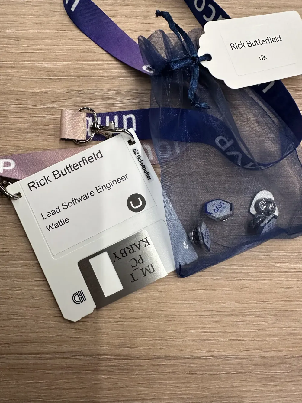 My floppy disk lanyard badge and three MVP badges